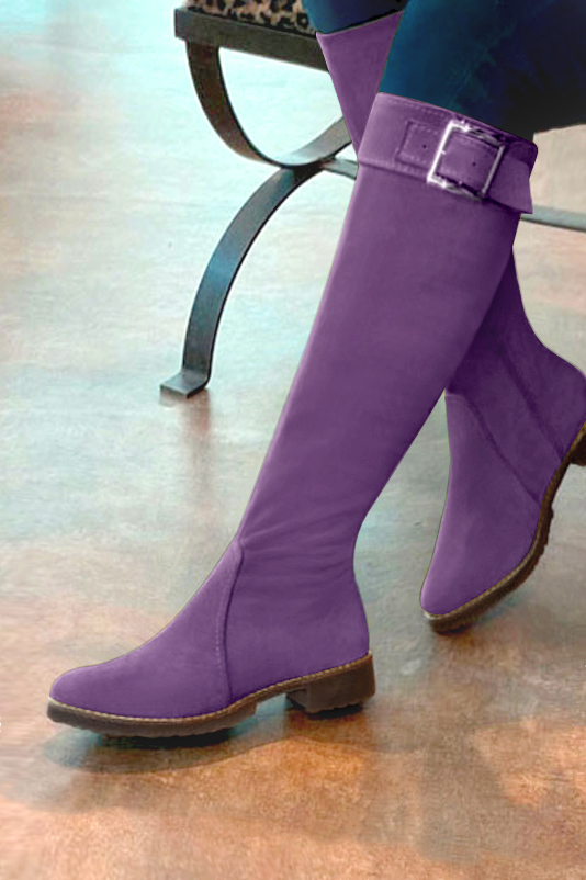 French elegance and refinement for these amethyst purple riding knee-high boots, 
                available in many subtle leather and colour combinations. Record your foot and leg measurements.
We will adjust this pretty boot with zip to your measurements in height and width.
Its large, comfortable gum sole will isolate you from the ground.
You can customise the boot with your own materials, colours and heels on the "My Favourites" page.
To style your boots, accessories are available from the boots page. 
                Made to measure. Especially suited to thin or thick calves.
                Matching clutches for parties, ceremonies and weddings.   
                You can customize these knee-high boots to perfectly match your tastes or needs, and have a unique model.  
                Choice of leathers, colours, knots and heels. 
                Wide range of materials and shades carefully chosen.  
                Rich collection of flat, low, mid and high heels.  
                Small and large shoe sizes - Florence KOOIJMAN